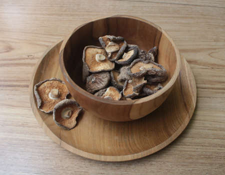 Close up Shitake Mushroom in wood bowlの写真素材