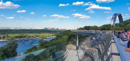 Kyiv, Ukraine - July 06, 2019: Panoramic view from new Pedestrian-Bicycle Bridge in Kyiv, Ukraine. New Klitschko Pedestrian-Bicycle Bridge one of the most interesting attractions of Kiev.のeditorial素材