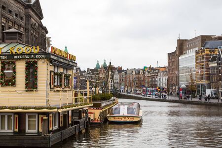Amsterdam, Netherlands - November 28, 2019: Boat tours in Rokin canal in Amsterdam, Netherlandsのeditorial素材