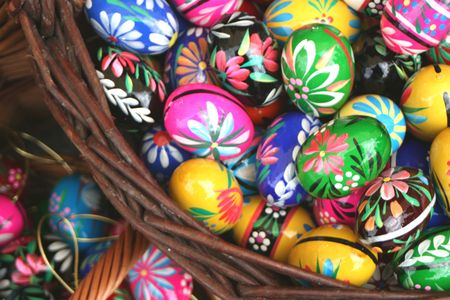 Traditional painted Easter eggs in a woven basketの写真素材