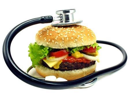Health concept of cheeseburger & stethoscopeの写真素材