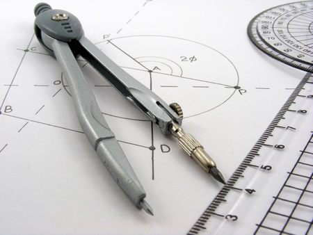 A geometrical themed image with a geometry diagram & utensils