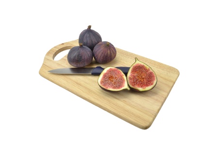 Fig fruit on wooden board with white background