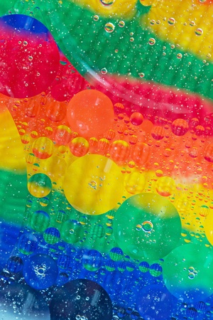 Abstract background of rainbow coloured transparent circles の写真素材