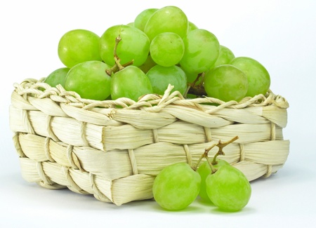 Selection of grapes in a basket on a white backgroundの写真素材