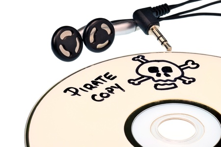Music piracy with pirate copy cd and headphonesの写真素材