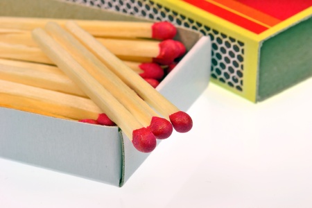 An open box of matches on a white backgroundの写真素材