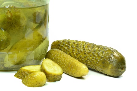 A jar of pickled gherkins on a white backgroundの写真素材