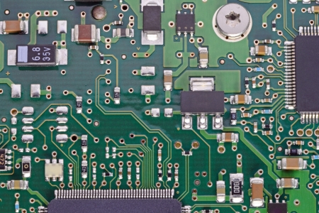 A close up of a computer circuit board with chipsの写真素材