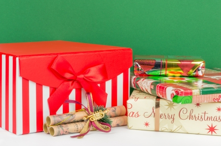 A Christmas gift box and presents with green backgroundの写真素材
