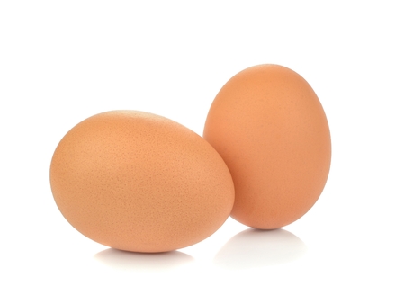 Fresh brown eggs on a white backgroundの写真素材