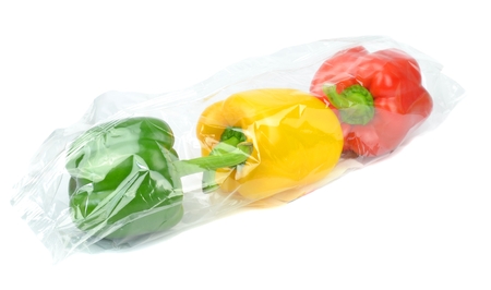 Fresh prepacked paprika peppers sealed in a cellophane bag の写真素材