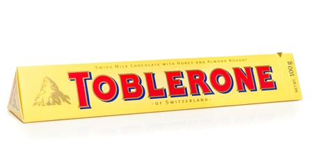 NIEDERSACHSEN, GERMANY OCTOBER 25, 2014: A bar of Toblerone milk cocolate on a white backgroundのeditorial素材