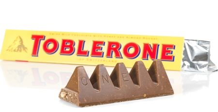 NIEDERSACHSEN, GERMANY OCTOBER 25, 2014: A bar of Toblerone milk cocolate on a white backgroundのeditorial素材
