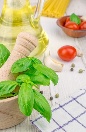 Traditional fresh ingredients for Italian cuisine on a rustic wooden backgroundの写真素材