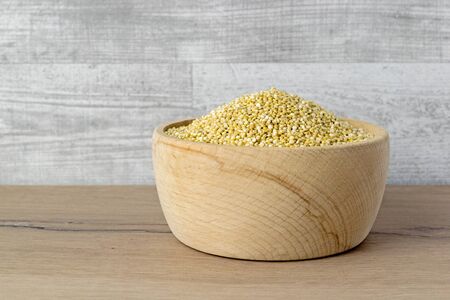 A wooden bowl of quinoa seeds with copy space for your textの写真素材