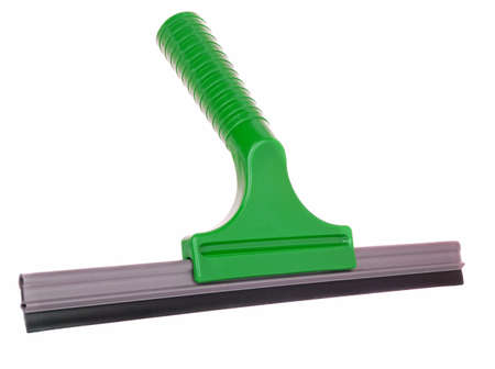 A green plastic squeegee window cleaning utensil on a white background