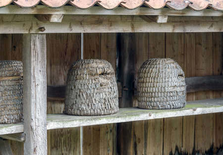 Traditional dome shaped woven bee hivesの写真素材