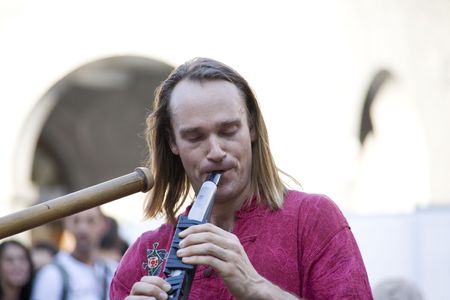 REGGIO, EMILIA, ITALY - AUGUST 22: electric flute player perform in the street at Buskers Festival. He is a street artist.Buskers Festival celebrate its 10th anniversary on August 22, 2010 in REGGIO, EMILIA, ITALYのeditorial素材