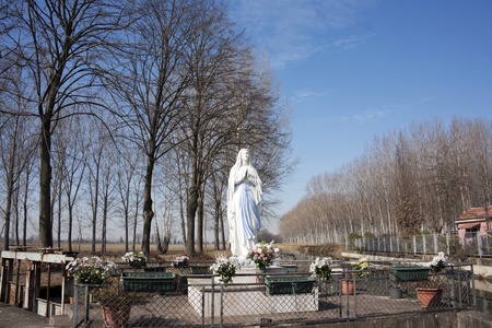 statue of virgin mary on the roadの写真素材