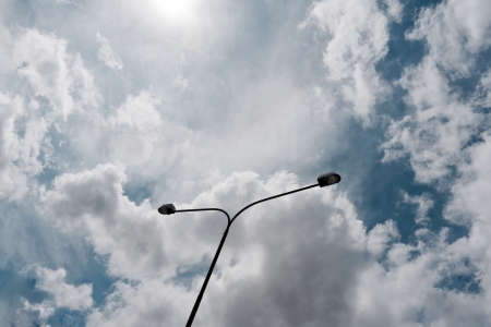 street lamp against cloudy skyの写真素材