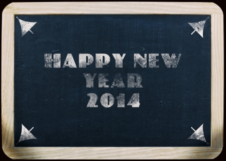 new year 2014 greeting on a blackboardの写真素材