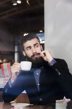 hipster businessman on break for a coffeeの写真素材