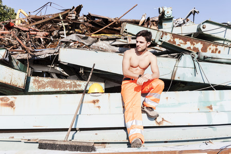 young worker in a junkyardの写真素材