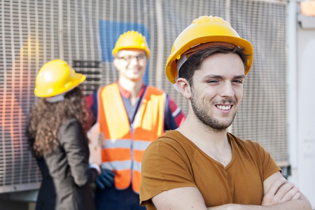 young workers in a junkyardの写真素材