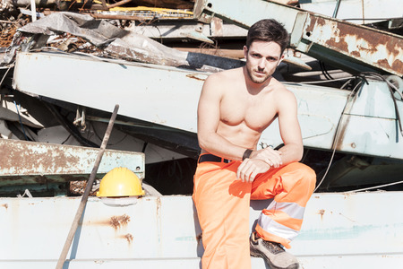 young worker in a junkyardの写真素材