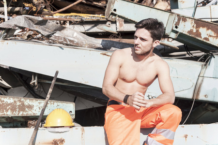 young worker in a junkyardの写真素材