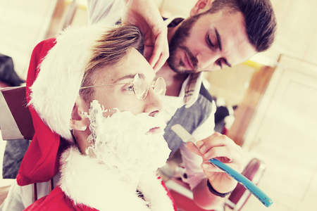 santa claus cut beard from his personal barberの写真素材
