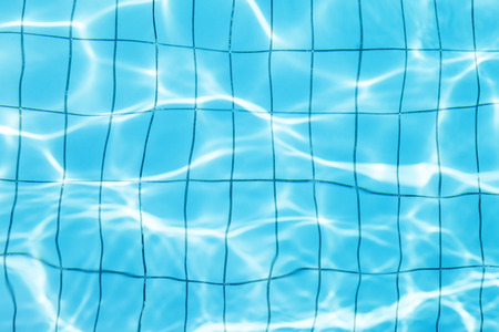blue wavy water background in swimming poolの写真素材