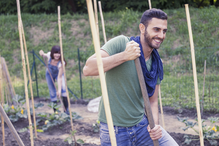 portrait of a young gardener at work in her greenhouseの写真素材