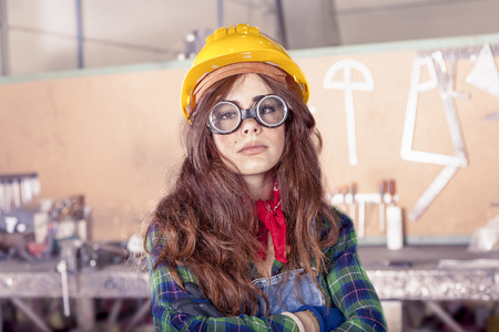 portrait of pretty female worker in a steel millの写真素材