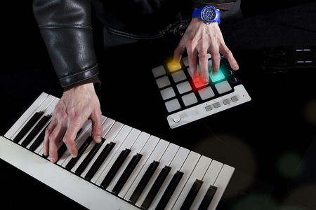 portrait of hands of producer dj at work in the recording studioの写真素材