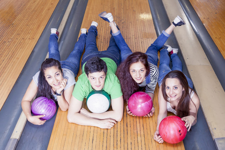 group of friends getting ready to play bowlingの写真素材
