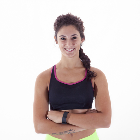 young sportswoman doing gymnastic exercises isolated on white backgroundの写真素材