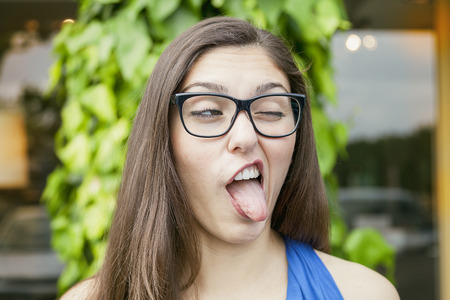 portrait of expressive beautiful girl outdoorsの写真素材