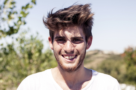 portrait of handsome young adult outdoor on vacationの写真素材