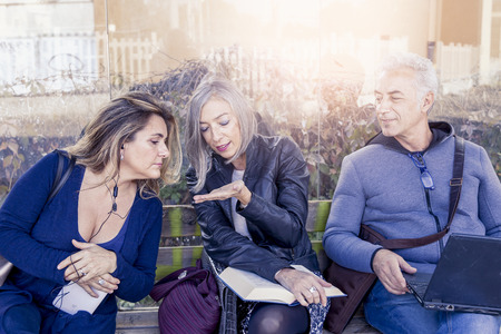 attractive people waiting at the bus stopの写真素材