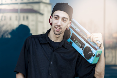 portrait of happy young skateboarder relaxes you in front of a stained glass windowの写真素材