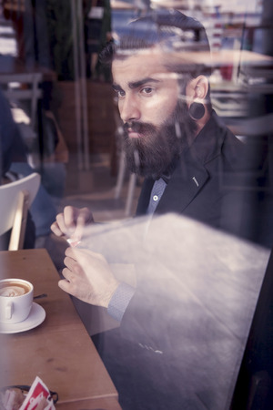 young hipster businessman on break for a coffeeの写真素材