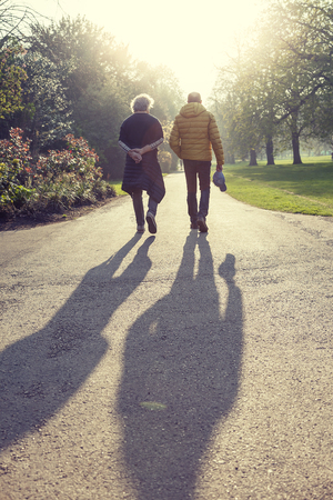 mature men friends enjoying vacation in a modern city - concept of active senior who travel and have funの写真素材