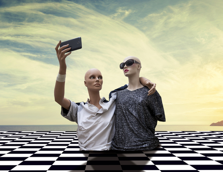 pair of dummies take a selfie dressed in seventies sportswear clothes above a checkered tile floor in black and whiteの写真素材