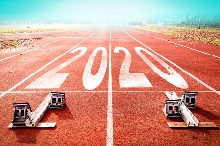 2020 New Year celebration on the racing lane with starting block. New Year arrival conceptの写真素材