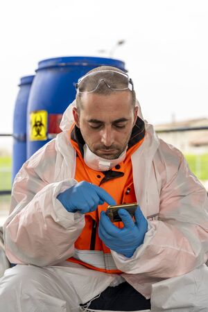 Antivirologist nurse is viewing statistics during the coronavirus health emergency outdoors