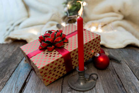 christmas decoration lights and red candle on wooden table. concept of Christmas atmosphereの写真素材