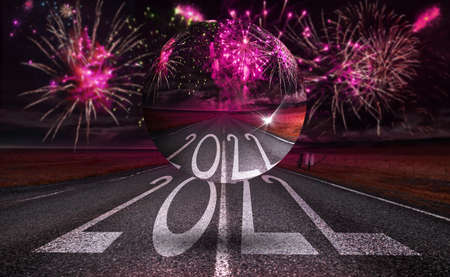 2022 New Year celebration with fireworks on horizon and floating transparent sphere on the road...