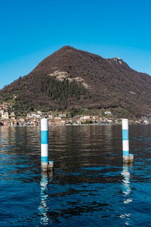 splendid view of monte isola facing the blue watersの写真素材